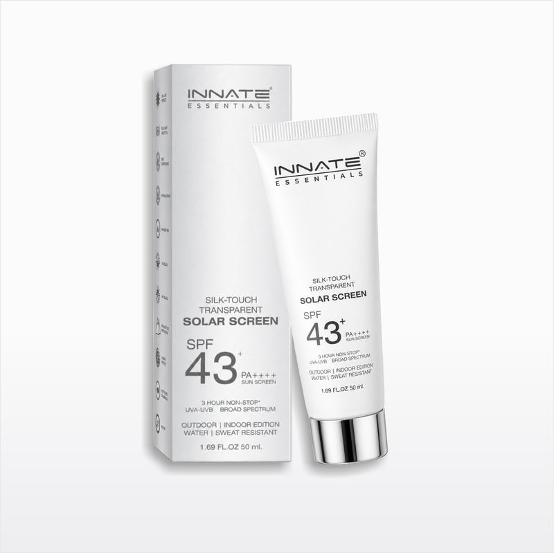 INNATE ESSENTIALs Silk-Touch Transparent Solar Screen SPF 43+ sunscreen in a white squeeze tube with a silver cap, shown next to its white packaging box on a light gray background.
