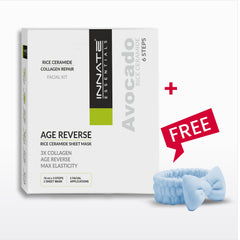 Innate Essentials Age Reverse Rice Ceramide Sheet Mask facial kit box shown next to a light blue silicone face mask with a bow and a red 'FREE' promotional badge on a white background.